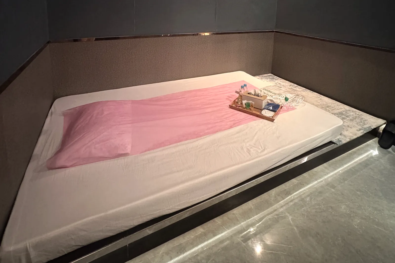 A private treatment room at Vessa Thai Spa, prepared with fresh linen